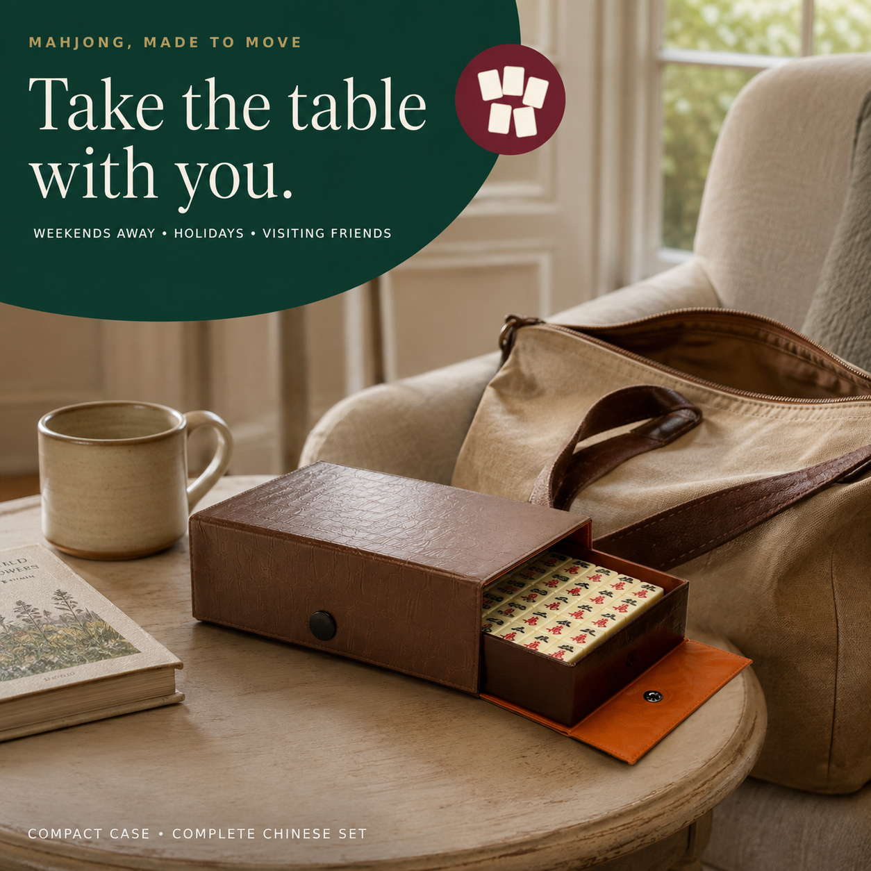 The Club Set open on a coffee table beside a travel bag